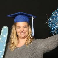 soon to be graduate with pom pom and foam finger
